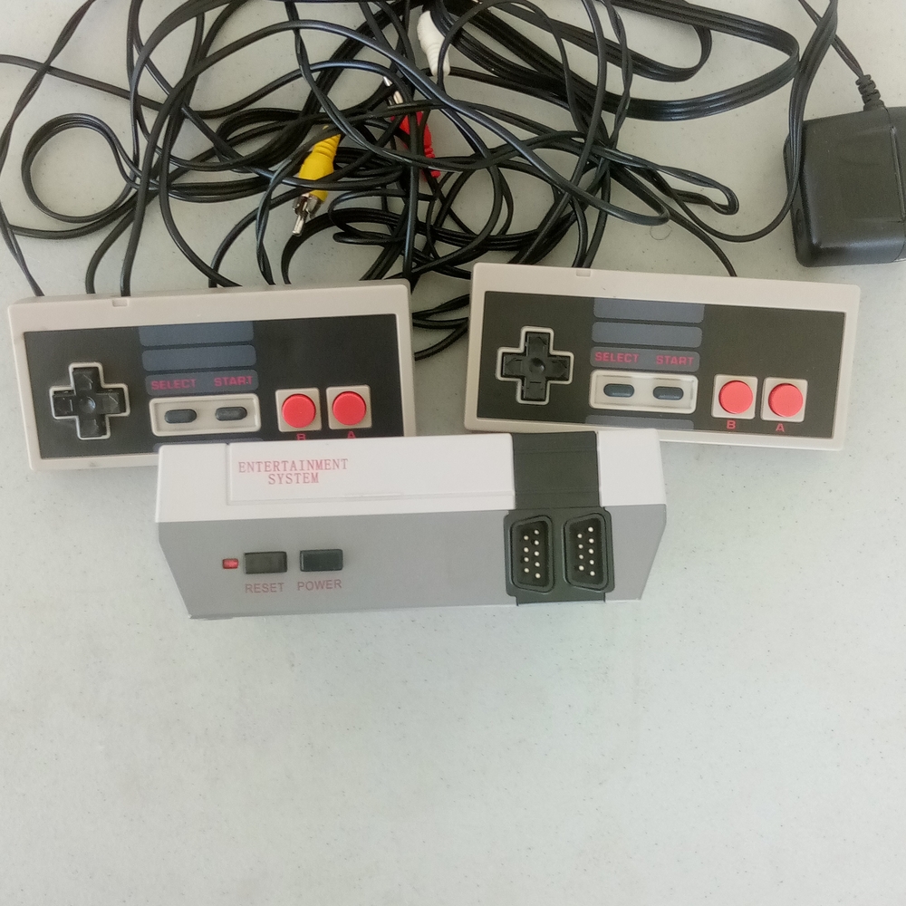 Gray and Black Entertainment System Console with Dual Controllers